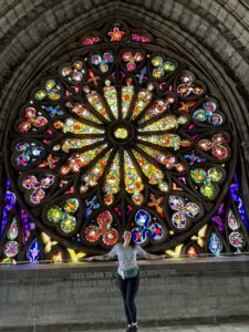 A beautiful mandala of stained glass inside Quito's Basilica del Voto Nacional church in Ecuador